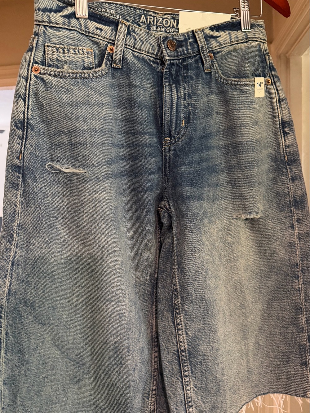 Women’s distressed jean shorts. 
Size 0.  New with tags